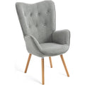 Fauteuil gris d'inspiration scandinave avec accoudoirs doux, assise genereuse en tissu et pieds en bois massif